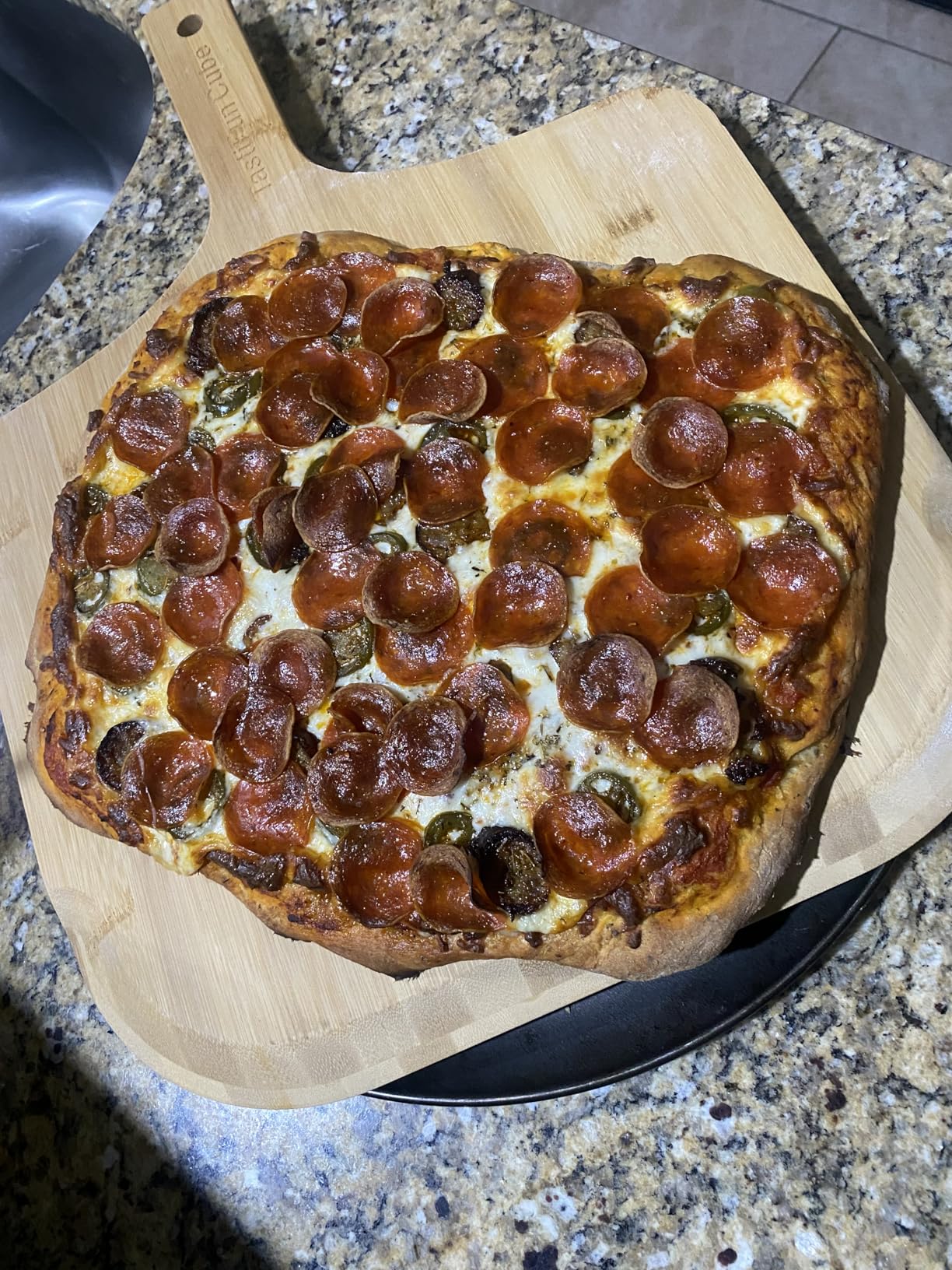 Unicook 12 Inch Round Pizza Stone for Oven and Grill, Cordierite Bread Baking Stone, Baking Crispy Pizzas, Bread and Cookies, Includes Carry Rack and Dough Scraper customer photo 1