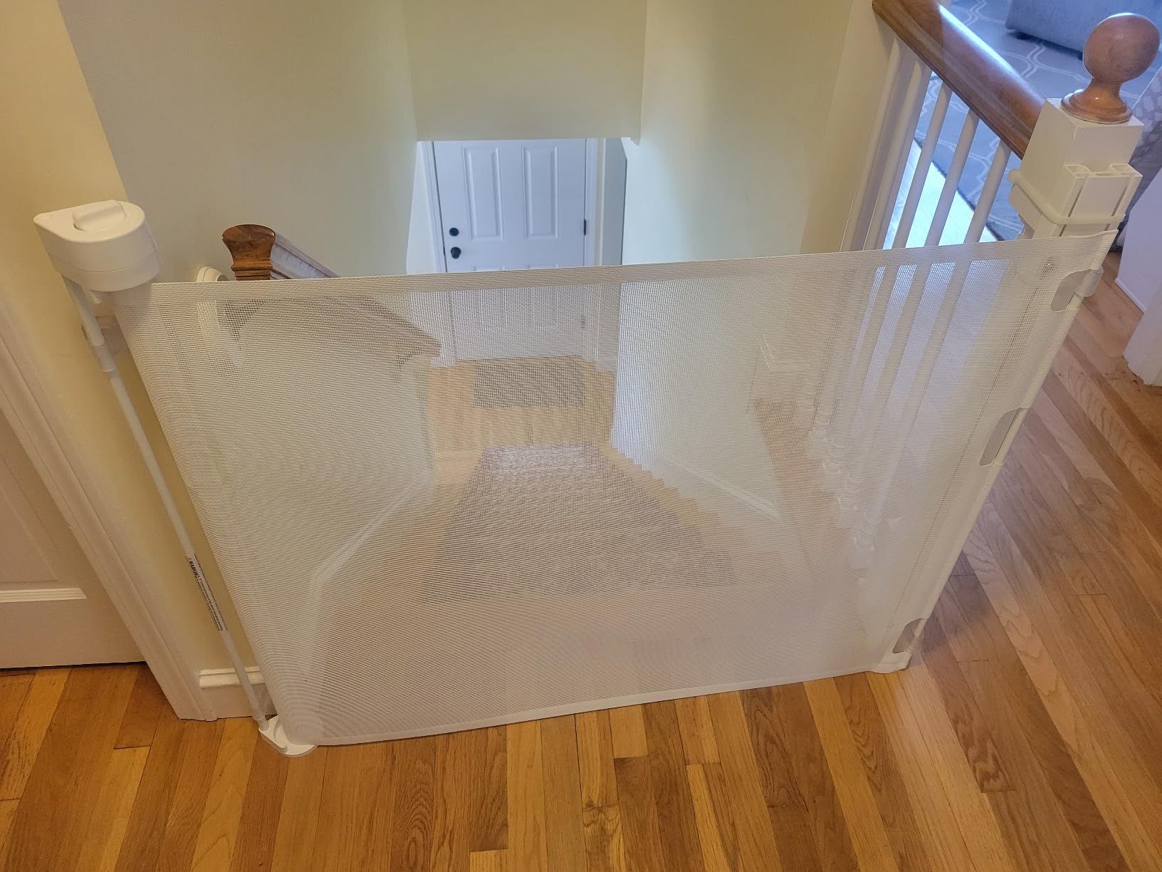 Retract-A-Gate 52 Inch White Retractable Baby and Dog Gate, Made in USA | The original certified retractable gate for top & bottom stairs; 200lb push-out force, angled installs, wide, tall, & sleek customer photo 2