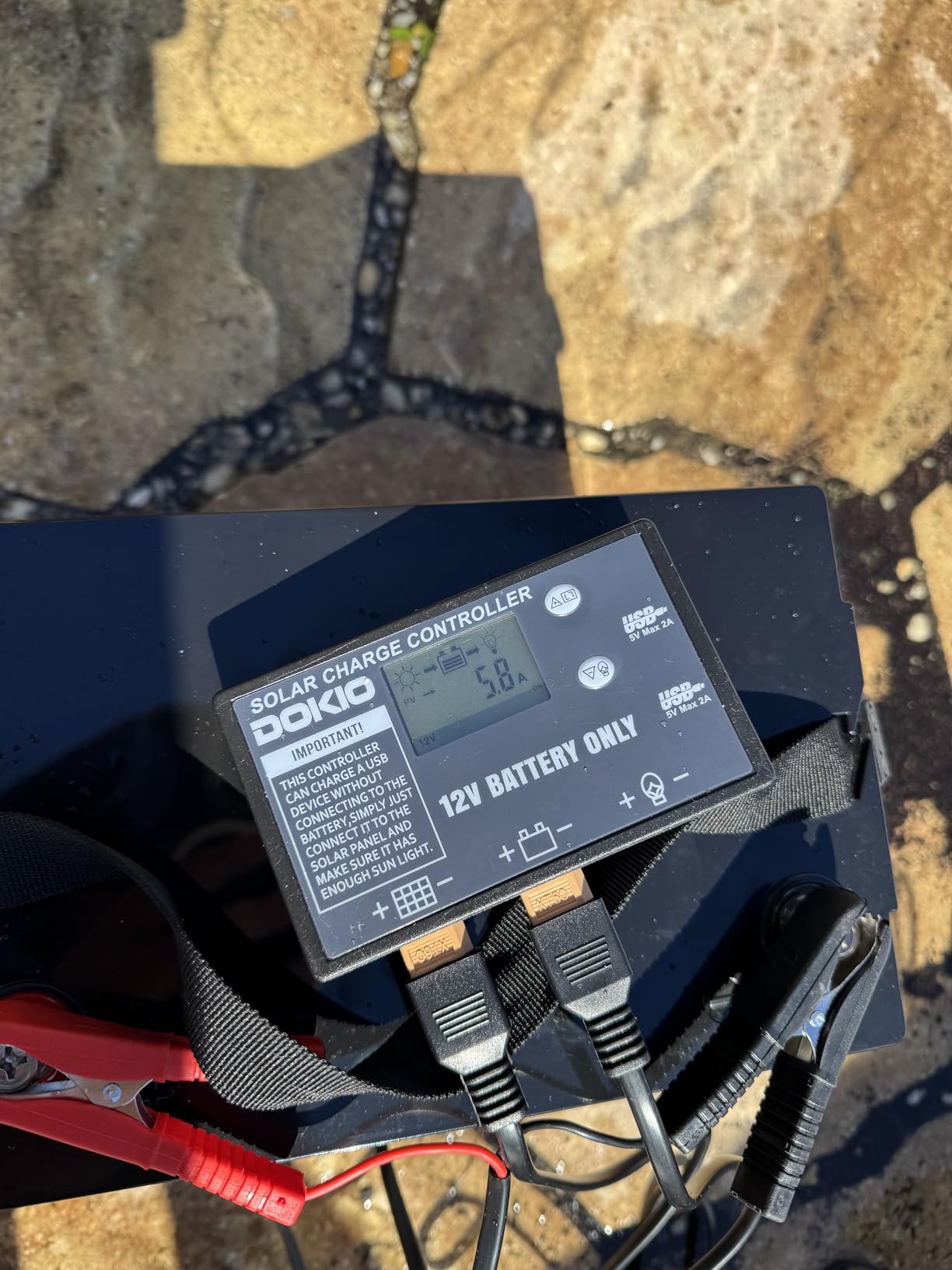 DOKIO 100W Portable Foldable Solar Panel Kit for 12V Battery Charging | Folds to 19 x 26 in and weighs 5.3 lb; includes controller and dual USB; for 12V batteries, power stations and camping. customer photo 1