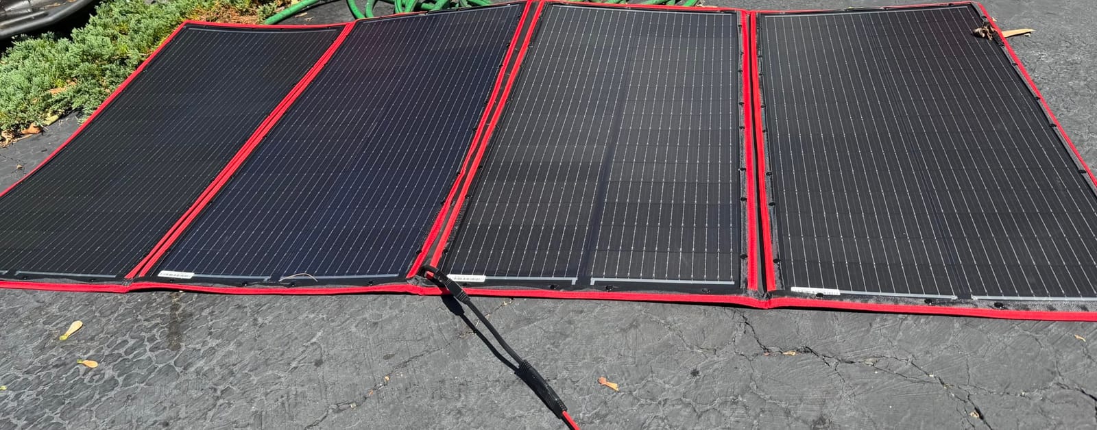 DOKIO 100W Portable Foldable Solar Panel Kit for 12V Battery Charging | Folds to 19 x 26 in and weighs 5.3 lb; includes controller and dual USB; for 12V batteries, power stations and camping. customer photo 2