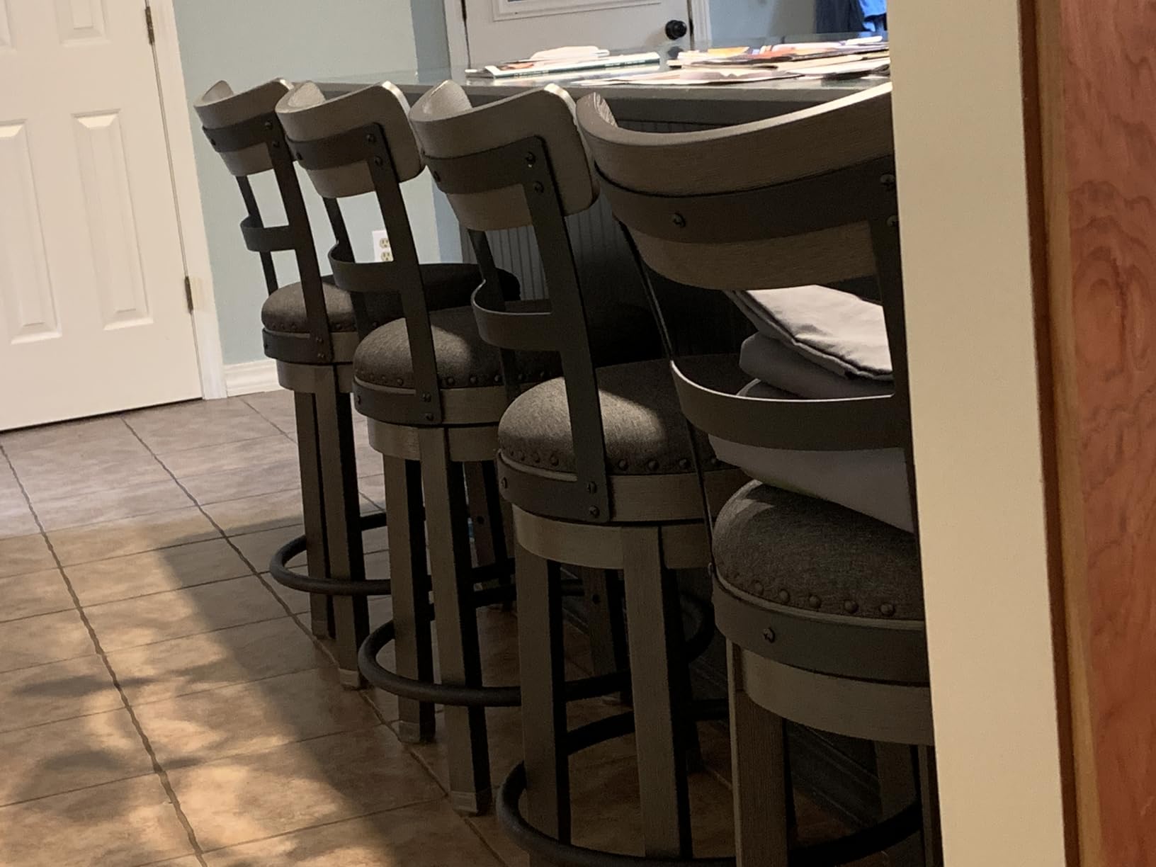 Signature Design by Ashley 1-Piece Swivel Counter Height Bar Stool, Gray | 24-inch seat height, Solid wood base, Metal back supports, Easy-clean polyester upholstery, Nailhead trim, Caitbrook Series customer photo 1